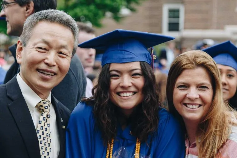 Wheaton Graduate with her Parents on Graduation Day