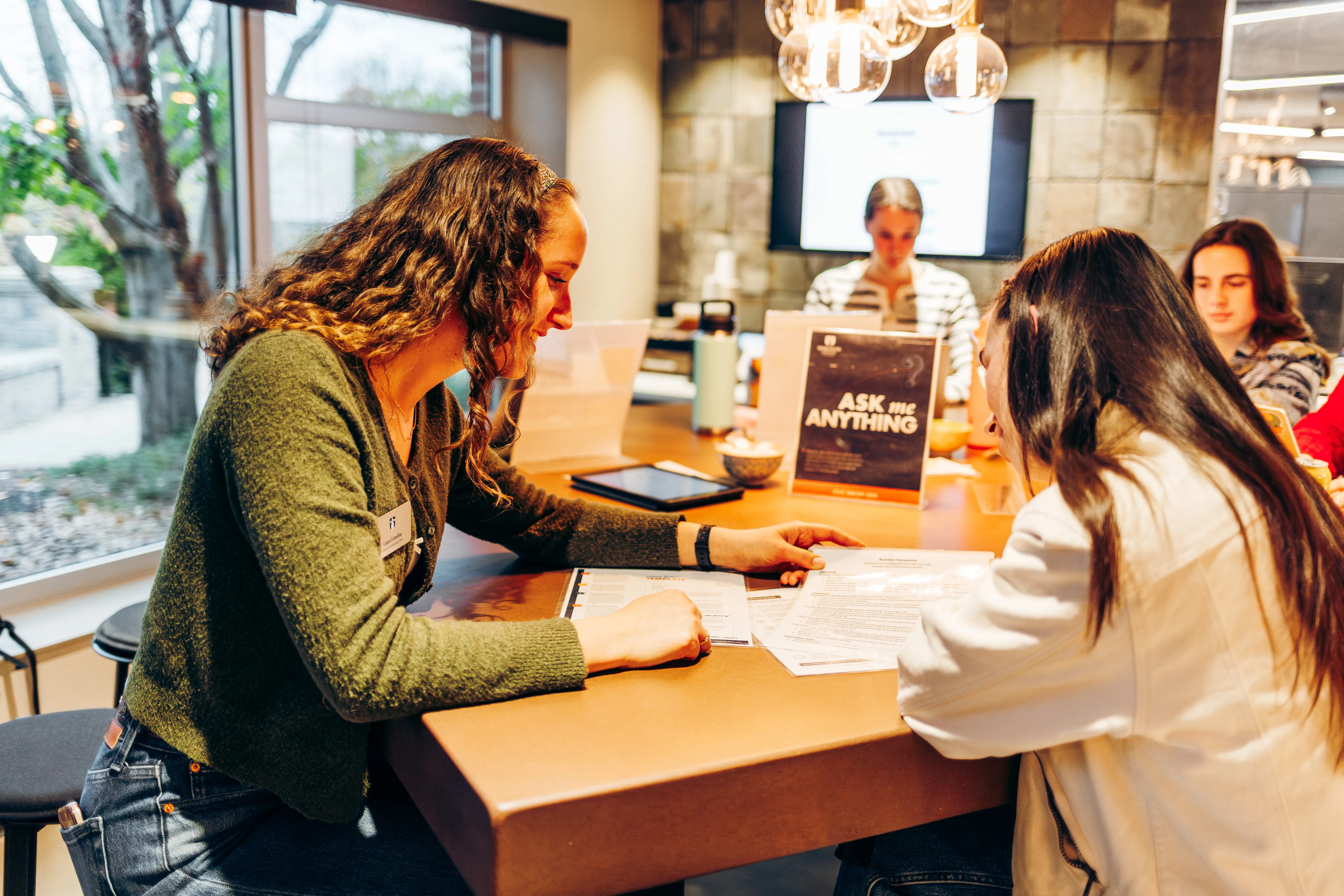 Two students sitting at a table together