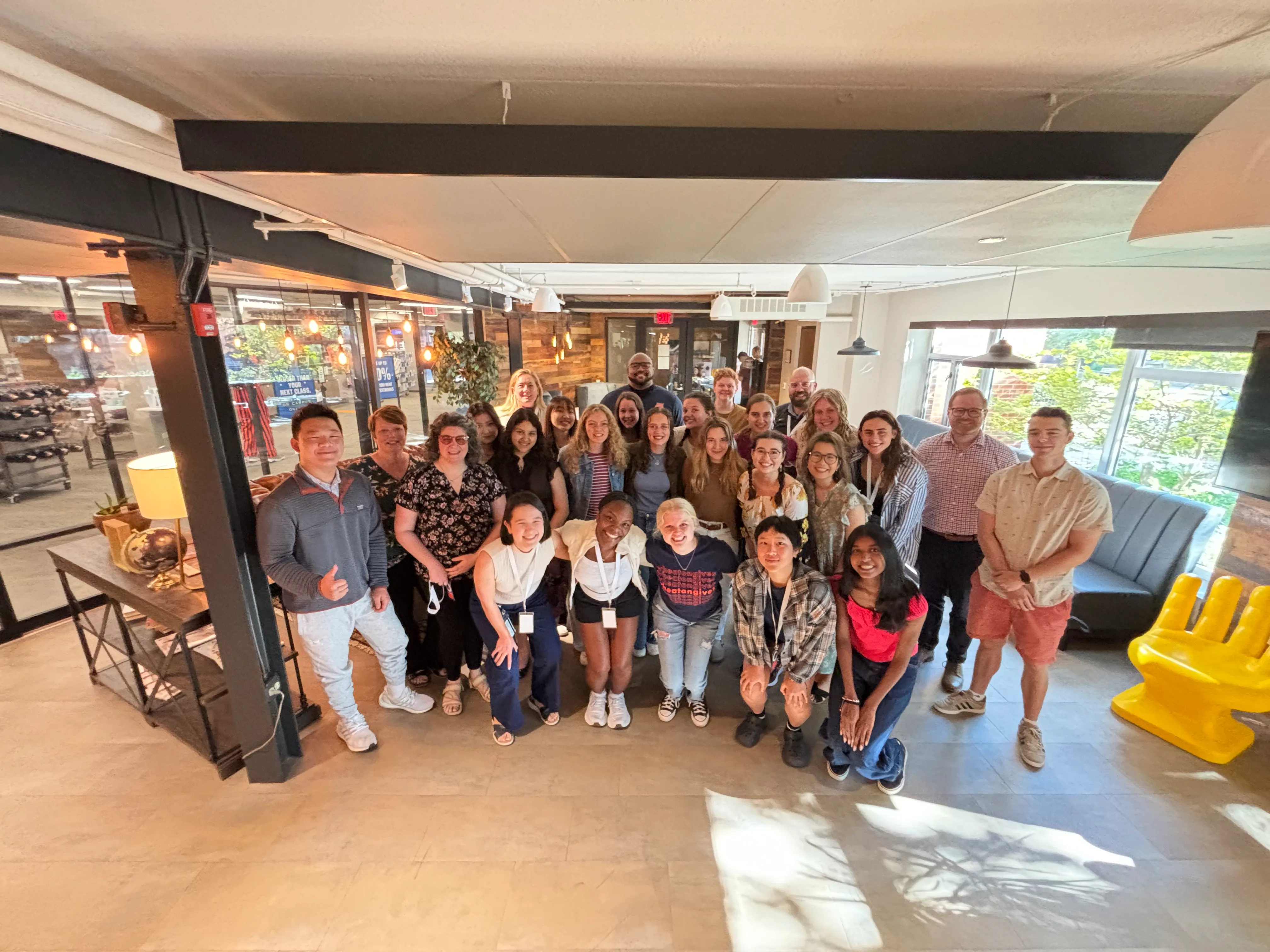 Group of student and full-time staff workers smiling