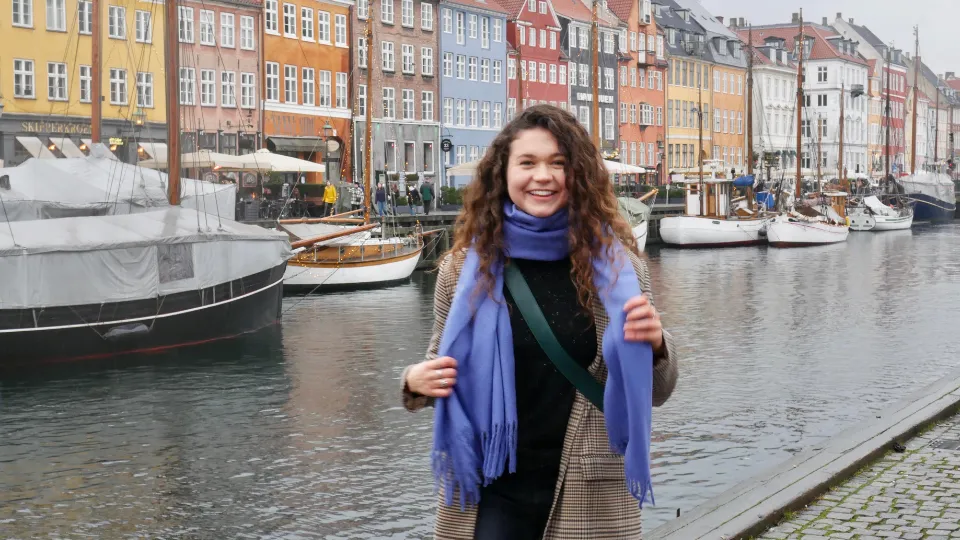 DIS student in front of canals in Copenhagen