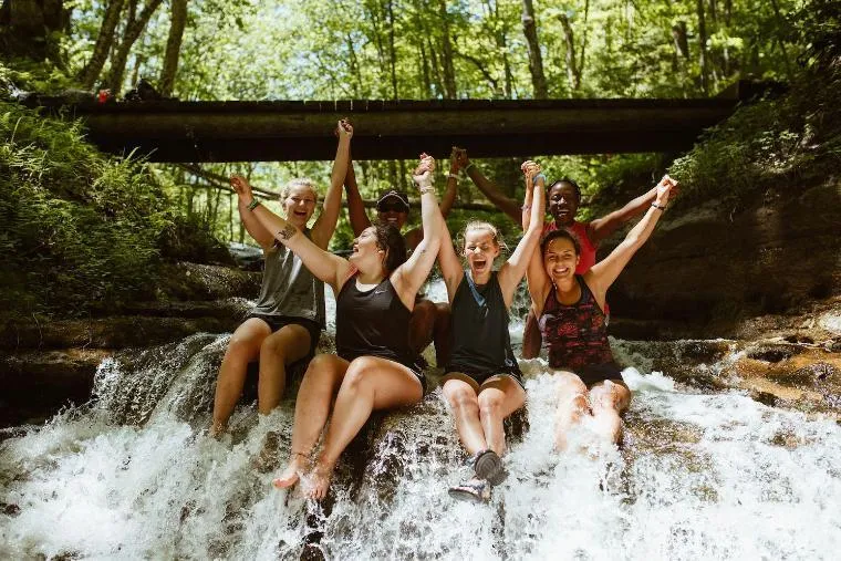 girls laughing on a wilderness trip