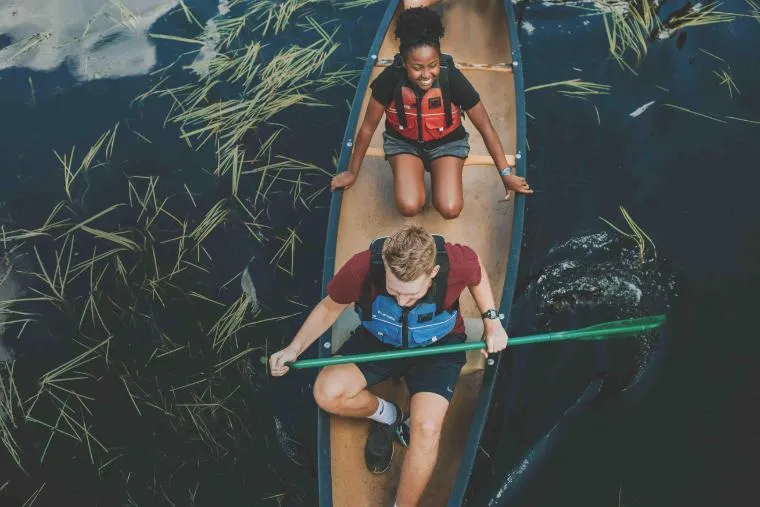 two students canoeing at honeyrock