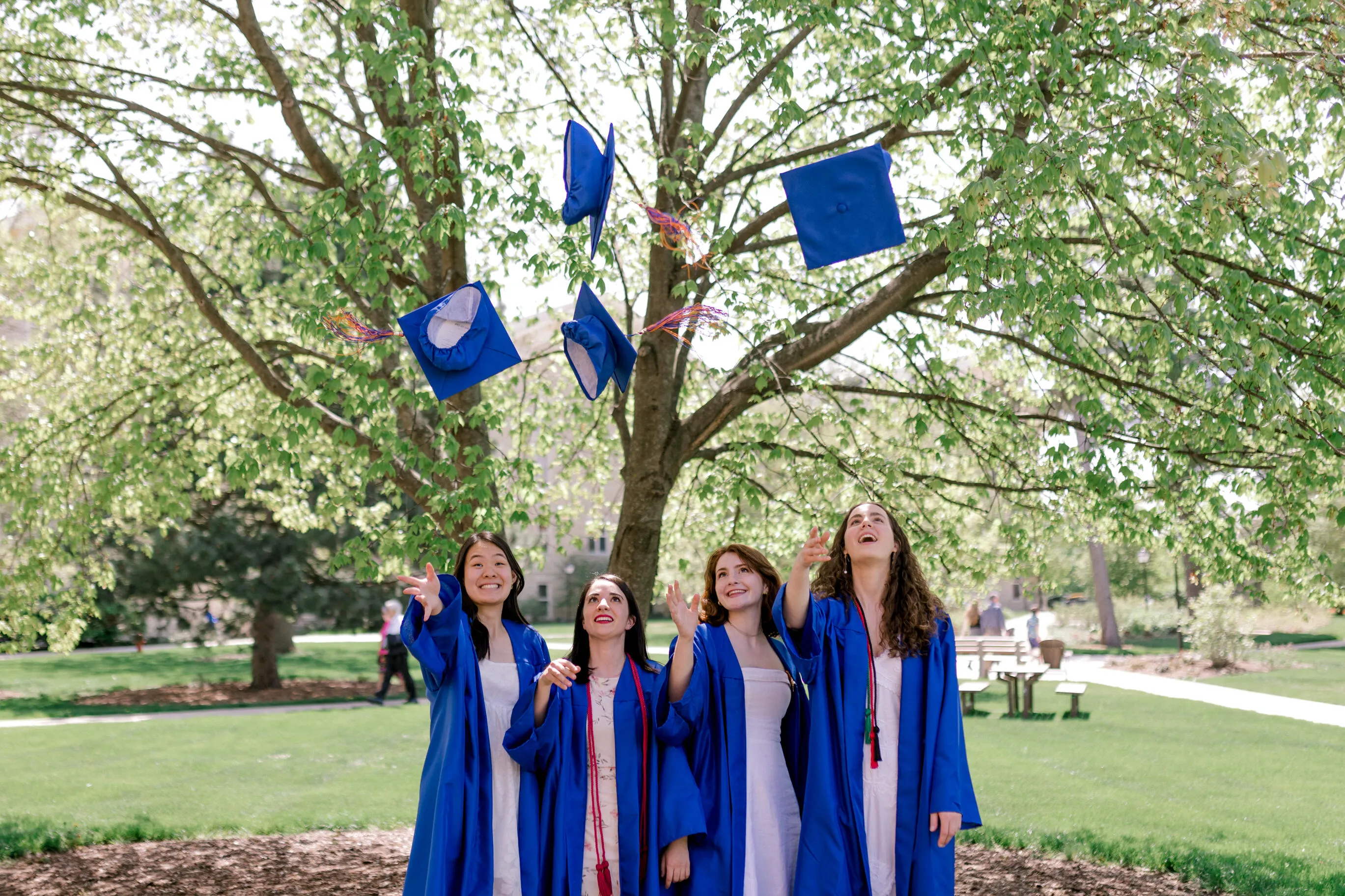 Undergraduates throwing their caps 2023