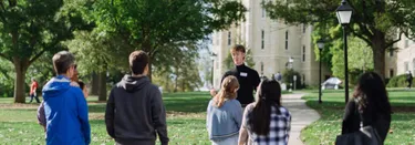 Deaconoi Tour Guide Leading Tour of Campus