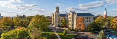 Blanchard Hall with Sun and Blue Skies and crossroads