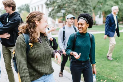 two students walking and talking