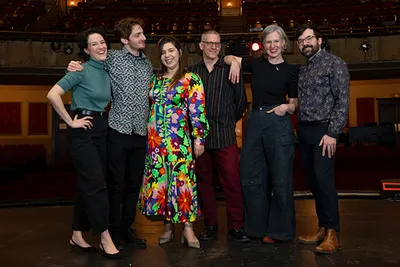 A group of people standing on stage