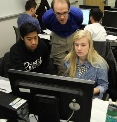 Devin Pohly helping computer science students