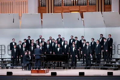 men singing on stage