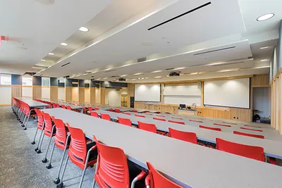A classroom with tables and chairs