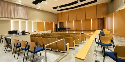 Recital Hall with chairs and a grand piano on stage
