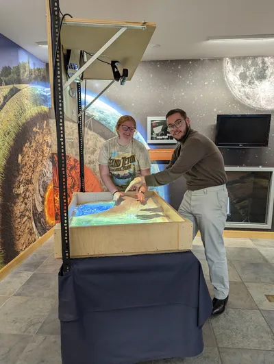 Geology students using augmented reality topographical sandbox
