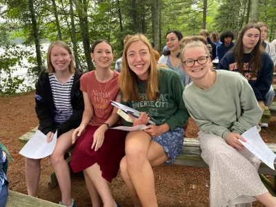 Four women at Cathedral Pines in HoneyRock during Passage.