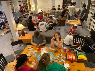 Students playing games in the Ryken's basement.
