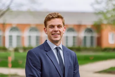 Jack smiling at the camera in business attire.