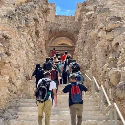 Students climbing the steps on a field excursion to Herodium.