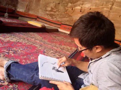 HNGR Student sketching in sketch book