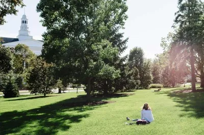 Student Studying on Blanchard Lawn at Wheaton College IL