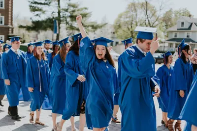 Wheaton College Undergrad Graduate Cheering on her way into Edman Chapel
