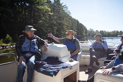 Several men sitting on a boat
