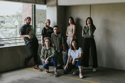 optimized photo students posing in parking garage