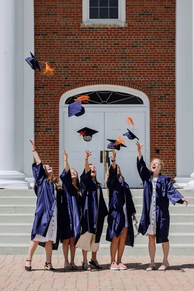 2025 Graduates Throwing Caps
