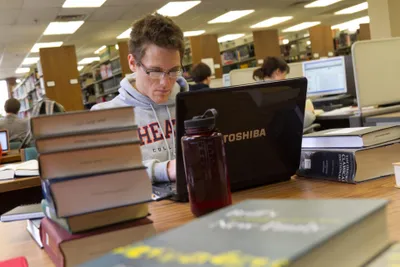 Student Studying in Wheaton College Library