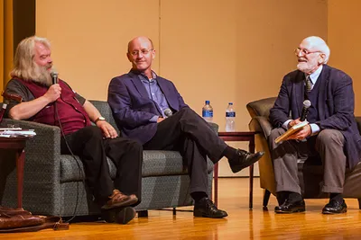 Three men talking