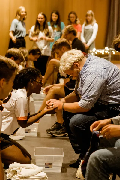 Wheaton Students praying at footwashing event