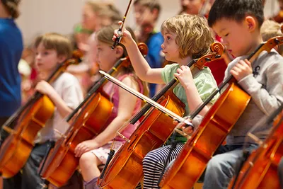 A group of children holding their cellos