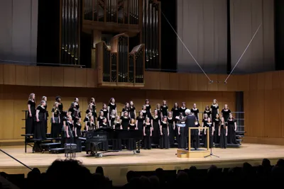 women's chorale singing in Armerding concert hall