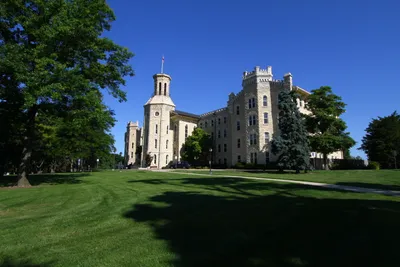 Blanchard Hall in summer with green lawn.