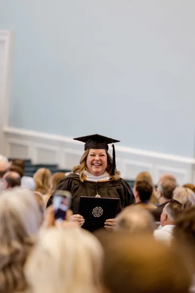 grad student with diploma
