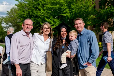 Graduate School Graduate with Family Spring 2024