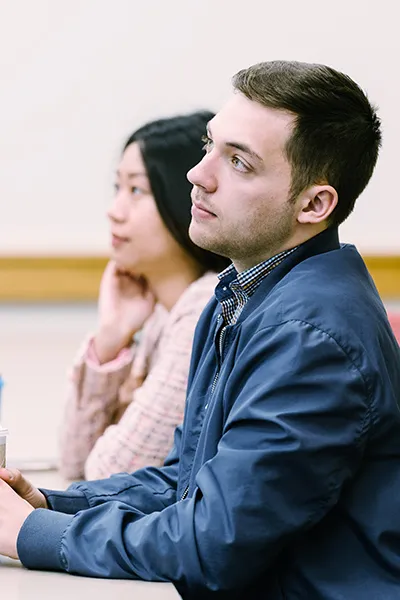Two students focusing on a class