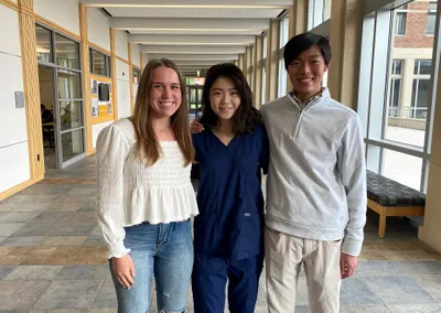 3 students in hallway