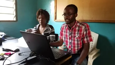 HNGR internship Bovell and Muteyan working in office