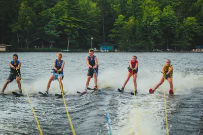 a line of students water skiiing on Long Lake