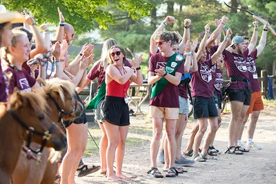 A group of people clapping