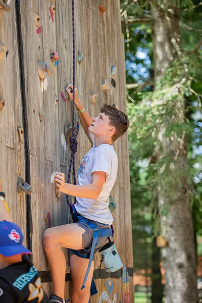 A boy doing rock climbing
