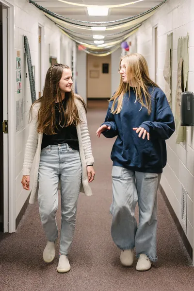 Two Female Students Walking in Smith Hall