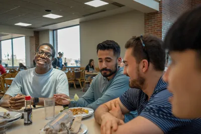 Guys at table in Anderson Commons