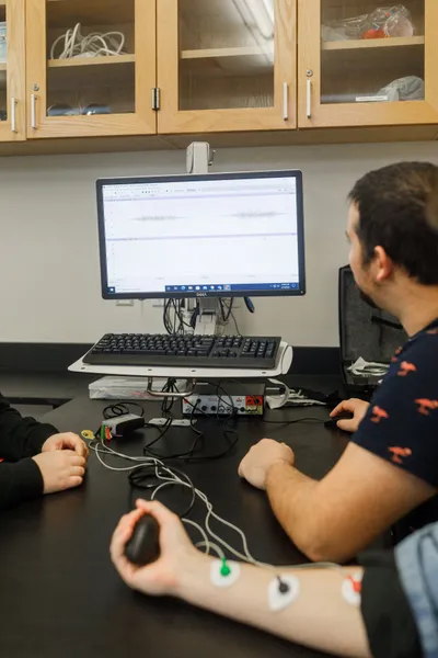 Wheaton College Neuroscience students looking at test results on a computer