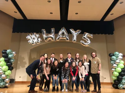 A group of student taking picture on stage