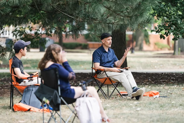 Anthropology Faculty Brian Howell teaching outside