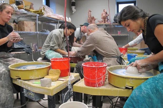 People working with ceramics