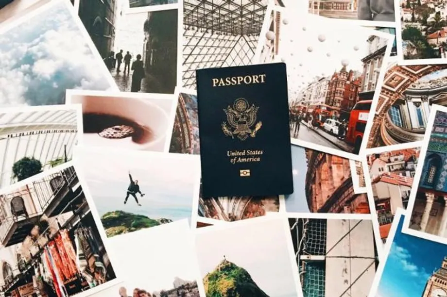 Passport with polaroid travel photos