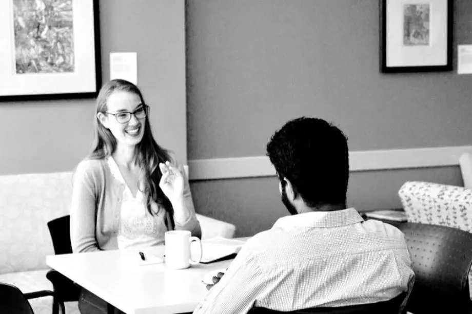 Two people sitting at a table
