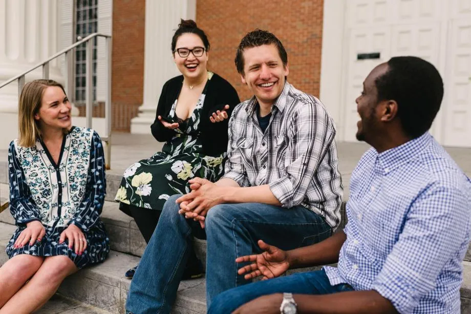 Wheaton College Graduate School students sitting together on steps