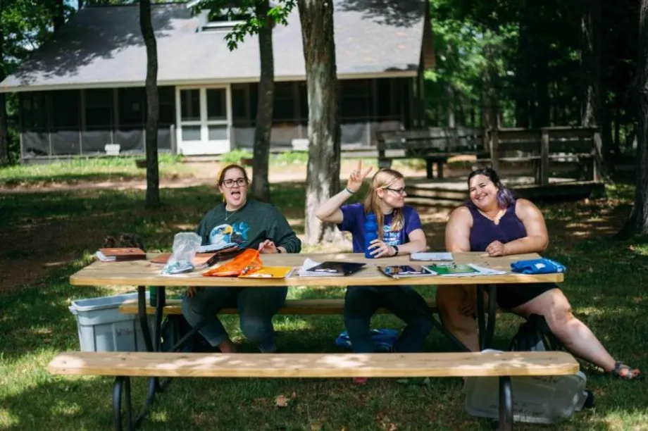 team of summer staff at picnic bench